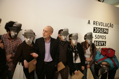 
	Antonio d’Avossa and people wearing Joseph Beuys masks at the show opening
